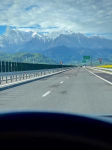 a view of a highway with mountains in the background at Casa Stelar - A breathtaking view in Moieciu de Jos