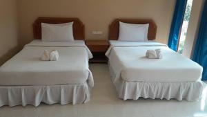 Кровать или кровати в номере Garden View Resort Tonsai