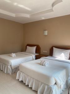 Кровать или кровати в номере Garden View Resort Tonsai