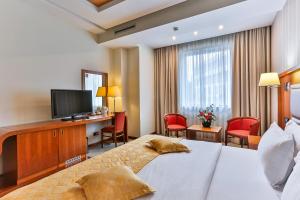 Voodi või voodid majutusasutuse Kings Park Hotel toas