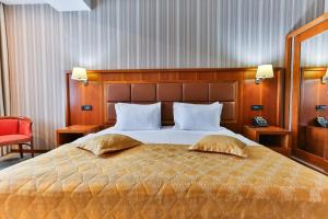 Voodi või voodid majutusasutuse Kings Park Hotel toas