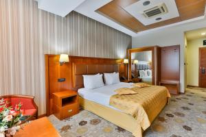 Voodi või voodid majutusasutuse Kings Park Hotel toas
