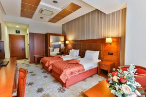 Voodi või voodid majutusasutuse Kings Park Hotel toas