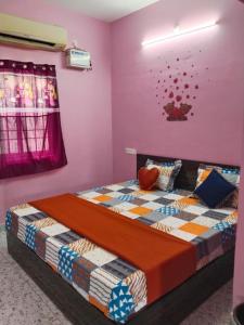 a bedroom with two beds in a room at Paradise Sunrise Beach Villa in Kottakupam +16 photos