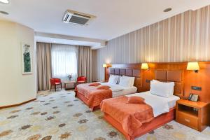 Voodi või voodid majutusasutuse Kings Park Hotel toas