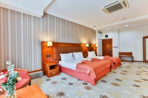 Voodi või voodid majutusasutuse Kings Park Hotel toas