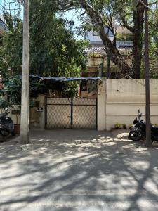 a fence with a gate with a blue rope at Ravish Apartment, Juhu in Mumbai
