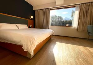 Postel nebo postele na pokoji v ubytování Fujinomori Hotel + 13 fotografií