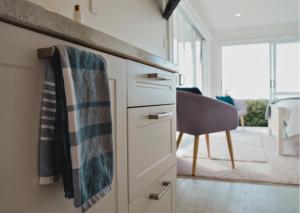 a kitchen with a counter with a towel on the drawer at Minden Meadows Retreat in Tauranga