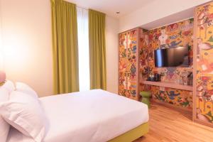 TV a/nebo společenská místnost v ubytování Hotel Marisa