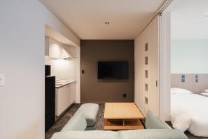 Postel nebo postele na pokoji v ubytování Hotel Ninestates Kagoshima