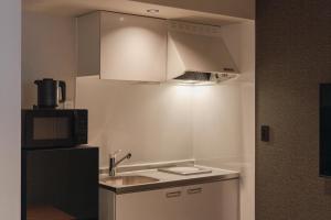 Kuchyň nebo kuchyňský kout v ubytování Hotel Ninestates Kagoshima