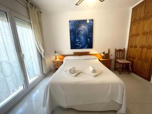 Posteľ alebo postele v izbe v ubytovaní ENCANTADORA CASA INDIVIDUAL CON VISTAS AL MAR Y PISCINA PRIVADA - ES-226-28