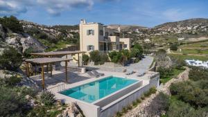 an image of a villa with a swimming pool at Avrofilito Syros Houses in Ermoupoli