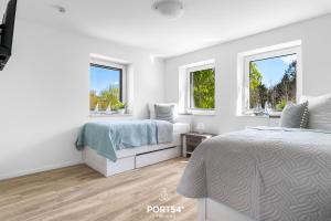 Postel nebo postele na pokoji v ubytování Ferienwohnung Winningmay 1 Füsing