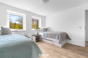 Postel nebo postele na pokoji v ubytování Ferienwohnung Winningmay 1 Füsing