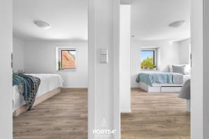 Postel nebo postele na pokoji v ubytování Ferienwohnung Winningmay 1 Füsing