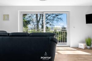 TV a/nebo společenská místnost v ubytování Ferienwohnung Winningmay 1 Füsing