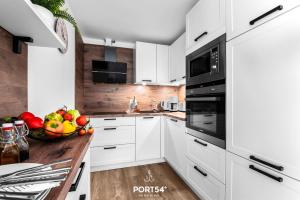Kuchyň nebo kuchyňský kout v ubytování Ferienwohnung Winningmay 1 Füsing