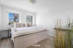 Voodi või voodid majutusasutuse Ferienwohnung Winningmay II Füsing toas