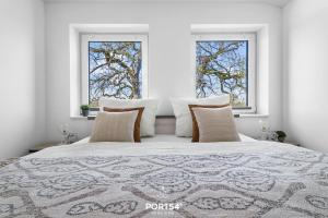 Voodi või voodid majutusasutuse Ferienwohnung Winningmay II Füsing toas