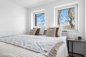 Voodi või voodid majutusasutuse Ferienwohnung Winningmay II Füsing toas