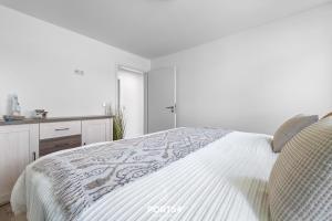 Voodi või voodid majutusasutuse Ferienwohnung Winningmay II Füsing toas +18 fotot