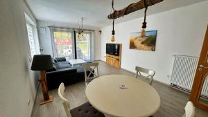 TV a/nebo společenská místnost v ubytování Ferienapartment Seemöwe im Haus "Baltic See"