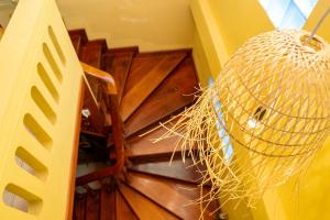 a view of a spiral staircase with a straw ball at La Casa Nostra in Luang Prabang