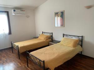 Ένα ή περισσότερα κρεβάτια σε δωμάτιο στο a casa di lu
