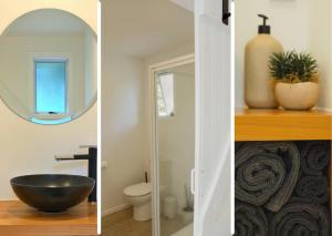 bagno con lavabo nero e specchio di Minden Meadows Retreat a Tauranga