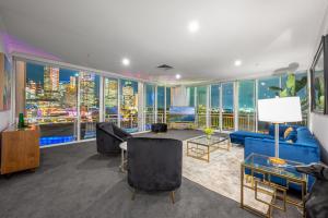 a living room with a view of a city at Exclusive Stays - Southgate in Melbourne