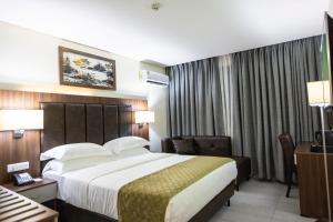 Krevet ili kreveti u jedinici u okviru objekta Jogor Hotel Ibadan