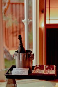a bottle of champagne in a bucket on a table at HOTEL ZEN-Adult Only in Hirosaki
