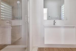 a white bathroom with a sink and a shower at Carnac - 7 Voyageurs - 100 % Nature in Crach +18 photos