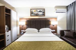 Krevet ili kreveti u jedinici u okviru objekta Jogor Hotel Ibadan