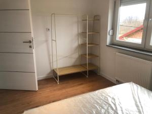 a room with a glass closet with a window at Apartment Vuleta in Prijedor