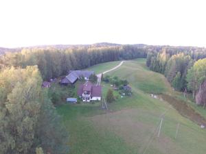 an aerial view of a house in the middle of a field at Mäe Farm in Rõuge