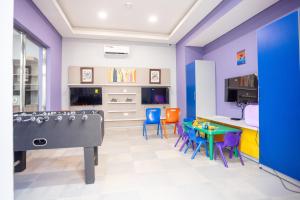 TV i/ili multimedijalni sistem u objektu Jogor Hotel Ibadan
