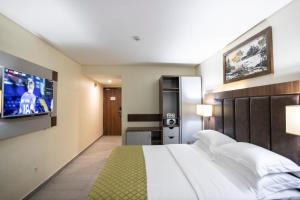 Krevet ili kreveti u jedinici u okviru objekta Jogor Hotel Ibadan