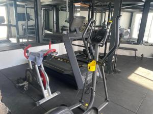 a gym with two treadmills and a treadmill at private loft-sea views-Jacuzzi in La Asomada