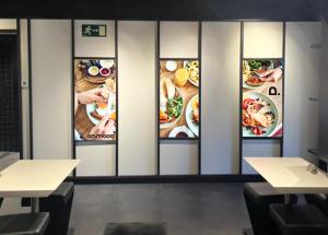 ein Restaurant mit vier Bildern von Essen an der Wand in der Unterkunft Onmood Cala Ratjada - New Opening 2024 in Cala Ratjada