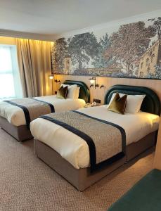 Postel nebo postele na pokoji v ubytování Menlo Park Hotel + 33 fotografií