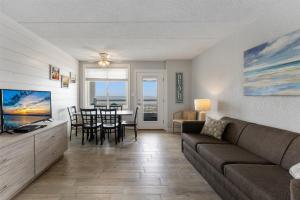 a living room with a couch and a dining room at 9103 Atlantic Ave, Unit 415 in Wildwood Crest