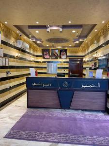 a store with a blue counter in a room at Al Tamayoz Al Raqi - Hiraa in Jeddah