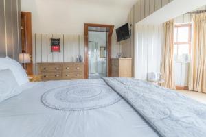 Giường trong phòng chung tại Glenvela guest house