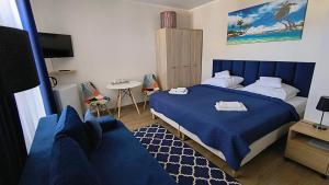 Łóżko lub łóżka w pokoju w obiekcie La Mer Pokoje i Apartamenty