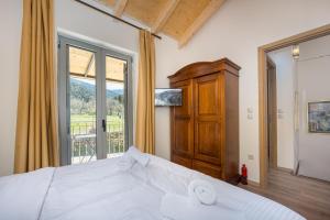 Postel nebo postele na pokoji v ubytování AROANIA suites