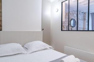 Llit o llits en una habitació de Lavie Maison A C & Sauna