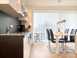 A kitchen or kitchenette at Quartier Hohe Geest 22